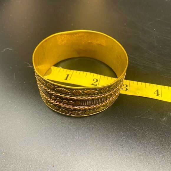 Ladies 8” brass bangle w/intricate engraving that appears to be Eastern Indian - Picture 6 of 10